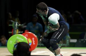 2016 Rio Olympics - Weightlifting - Final - Men's 77kg - Riocentro - Pavilion 2 - Rio de Janeiro, Brazil - 10/08/2016. Andranik Karapetyan (ARM) of Armenia gets injured as he competes. REUTERS/Yves Herman FOR EDITORIAL USE ONLY. NOT FOR SALE FOR MARKETING OR ADVERTISING CAMPAIGNS.