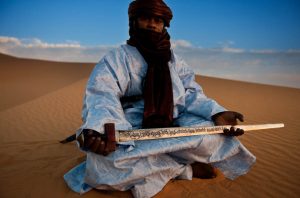 DJANET, ALGERIA, 3 MAY: A Tuareg man poses with the sword handed to the Tuareg leader by the French after the Tuareg were finally defeated at the battle of Tit, photographed in the desert outside the Tuareg town of Djanet, on April 9, 2009. (Photo by Brent Stirton/National Geographic.)