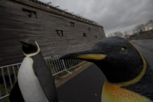 Life-seize replica's of penguins are seen outside a full scale replica of Noah’s Ark which has opened its doors in Doredrecth, Netherlands, Monday Dec. 10, 2012, after receiving permission to host up to 3,000 visitors per day. Stormy weather could do nothing to dampen the good mood of its creator, Dutchman Johan Huibers: in fact, the rain was appropriate. For those who don’t know or remember the Biblical story, God ordered Noah to build a boat massive enough to save animals and humanity while God destroyed the rest of the earth in an enormous flood. (AP Photo/Peter Dejong)