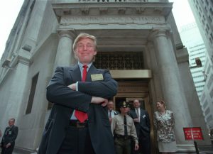 Donald Trump poses for photos outside the New York Stock Exchange after the listing of his stock on Wed., June 7, 1995 in New York.