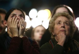 Supporters of Hillary Clinton watch and wait at her election night rally in New York. REUTERS/Carlos Barria