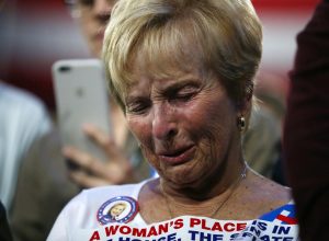 A supporter of Hillary Clinton watches and waits at her election night rally in New York. REUTERS/Carlos Barria