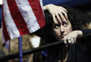 A supporter of Hillary Clinton watches results at the election night rally in New York. REUTERS/Rick Wilking